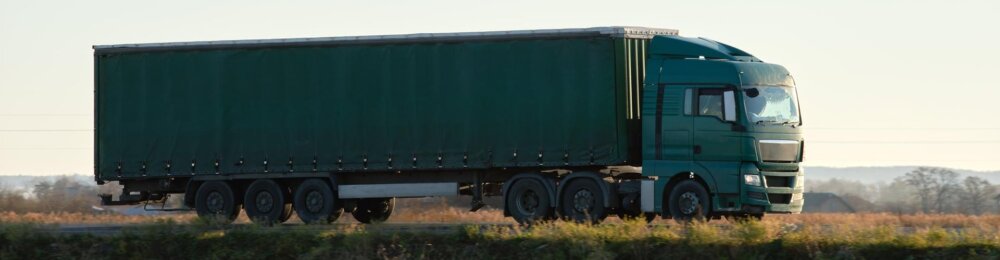 truck, carrying cargo, green truck, truck on the road